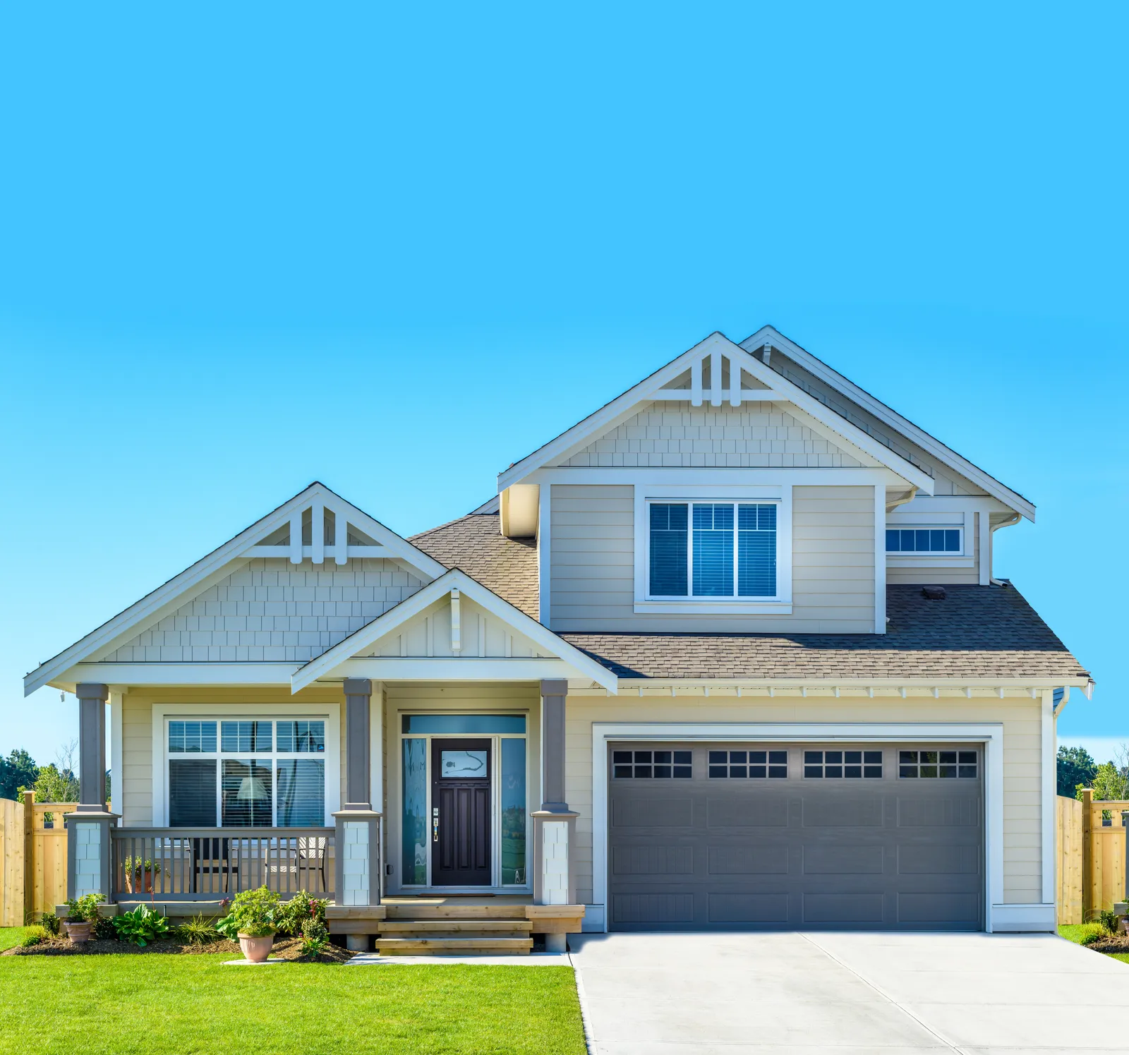 Craftsman style home with gray shingle roof and double garage